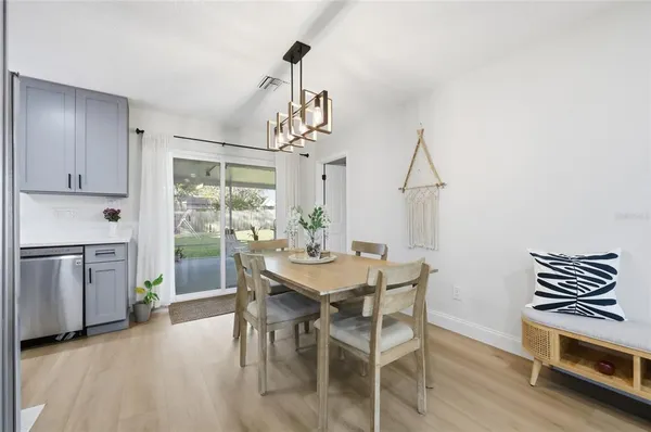 a kitchen with stainless steel appliances granite countertop a refrigerator stove microwave and sink