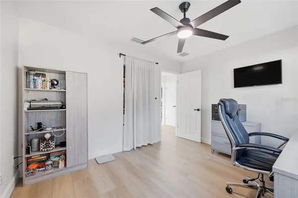 a bedroom with a bed and a table