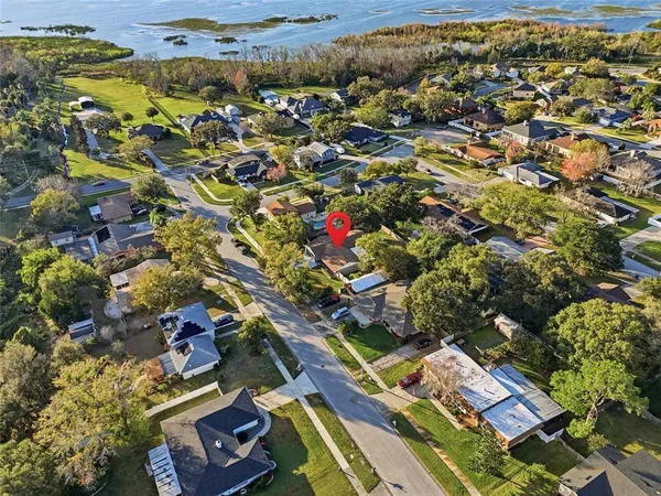 an aerial view of residential houses with outdoor space