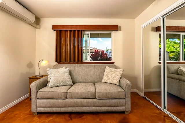 a living room with furniture and a window