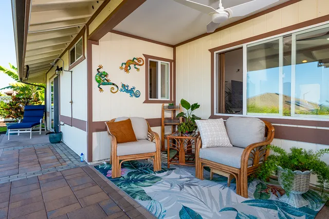 a outdoor living space with furniture and a potted plant