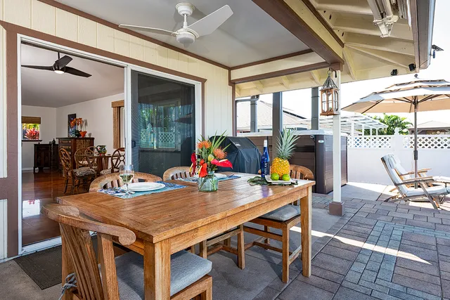 a view of a dining room with furniture large window and outside view