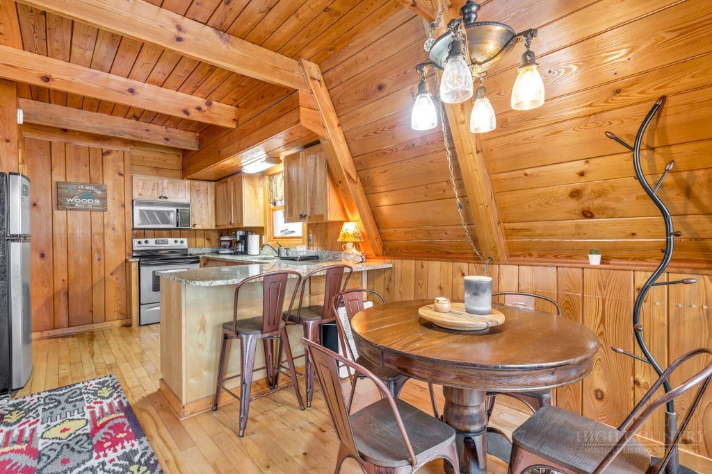 233 Cherry Drive Boone, NC 28607 - Photo 5 of 20 a kitchen with a table and chairs in it