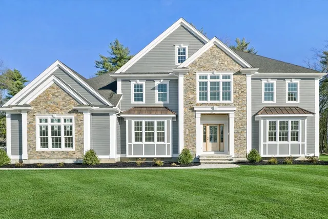 a kitchen with stainless steel appliances a refrigerator a sink a stove and cabinets