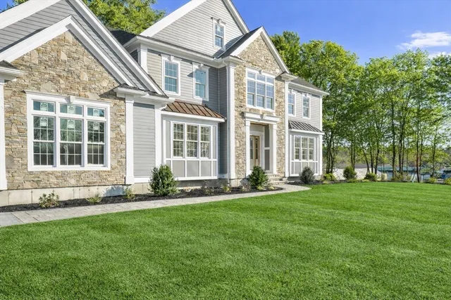 a kitchen with stainless steel appliances sink a refrigerator and window