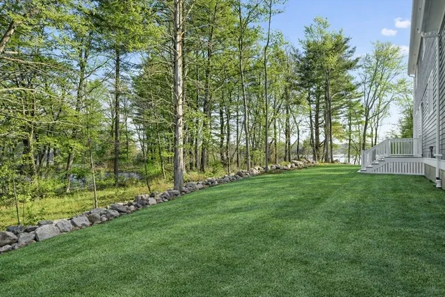 a kitchen with a sink cabinets and a window
