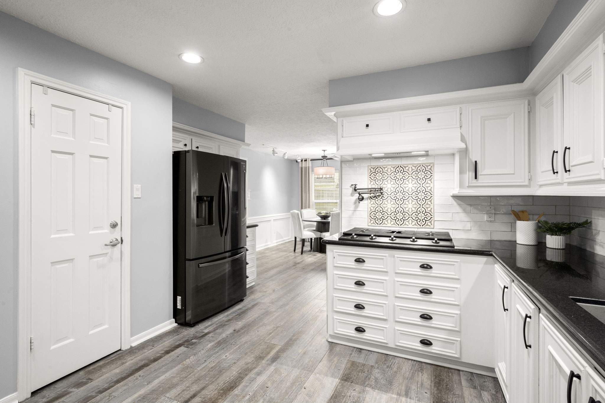 16111 Maplehurst Drive Spring, TX 77379 - Photo 12 of 30 a kitchen with granite countertop cabinets and stainless steel appliances