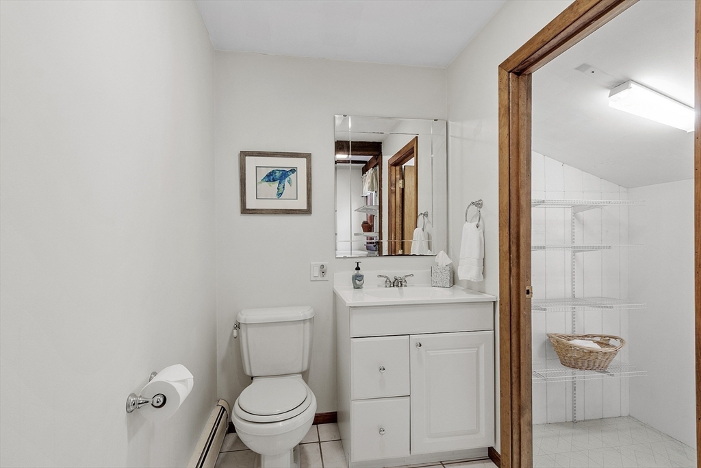 51 Kenney Road Middleton, MA 01949 - Photo 15 of 33 a bathroom with a toilet sink and mirror