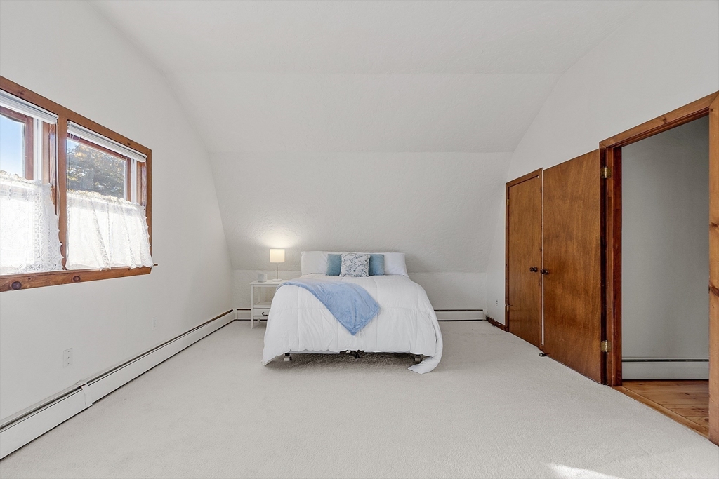 51 Kenney Road Middleton, MA 01949 - Photo 17 of 33 a spacious bedroom with a bed and a window