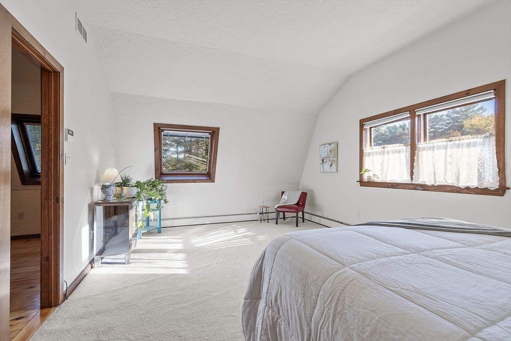 51 Kenney Road Middleton, MA 01949 - Photo 18 of 33 a bedroom with a bed a painting and a window