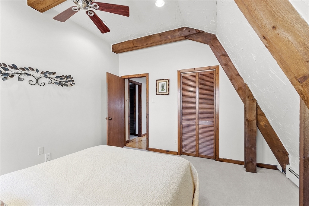 51 Kenney Road Middleton, MA 01949 - Photo 22 of 33 a bedroom with bed and balcony