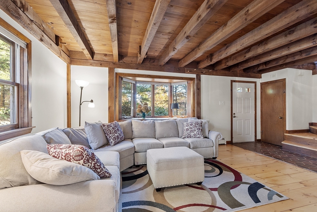 51 Kenney Road Middleton, MA 01949 - Photo 6 of 33 a living room with furniture and a large window