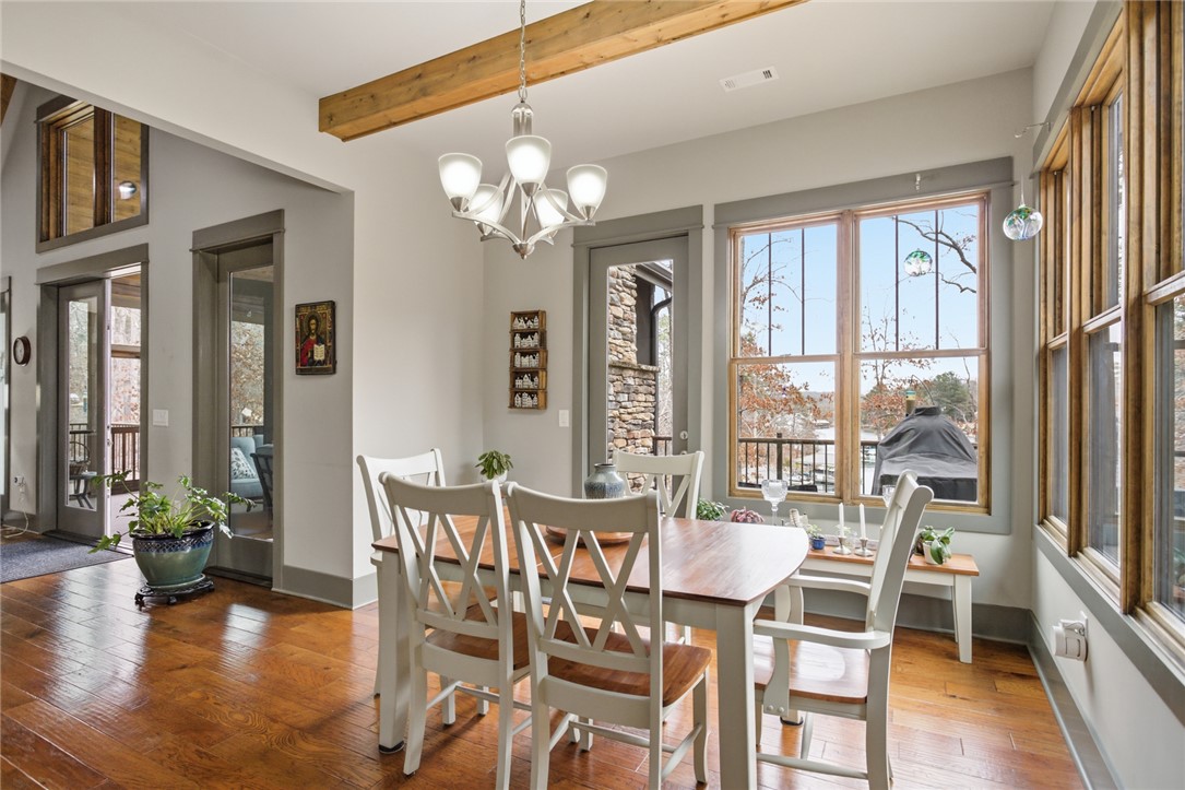 412 Walking Fern Way Seneca, SC 29672 - Photo 11 of 45 This dining area features rich wood flooring, large windows, and a beamed ceiling.