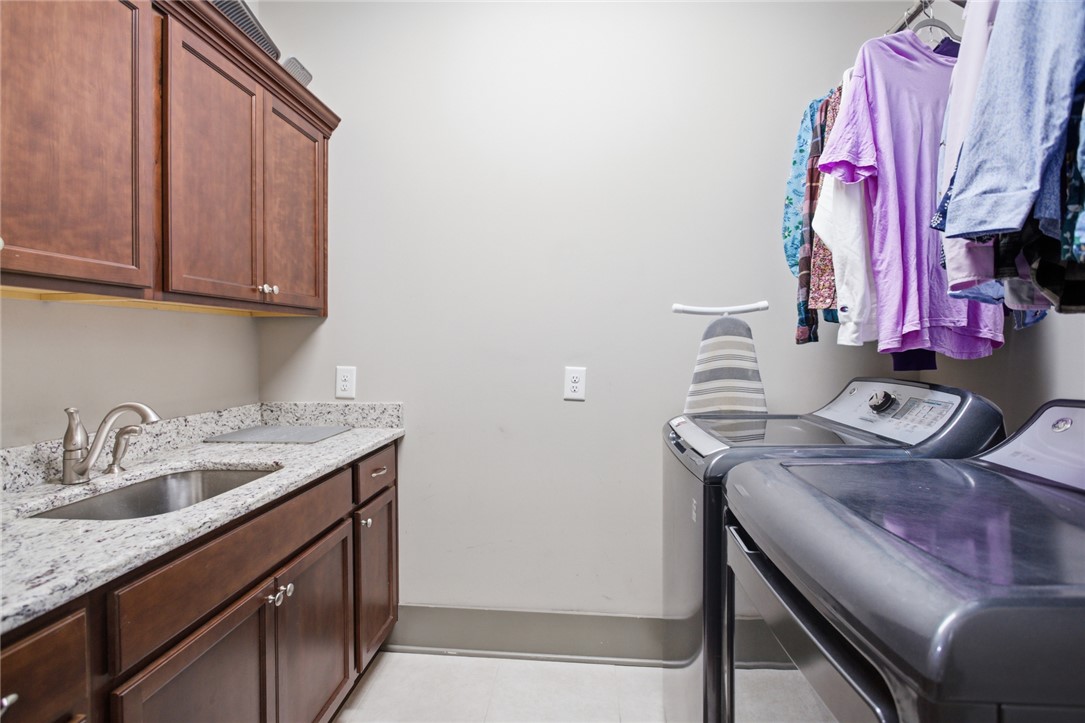 412 Walking Fern Way Seneca, SC 29672 - Photo 20 of 45 Functional laundry space featuring a convenient laundry sink and storage.