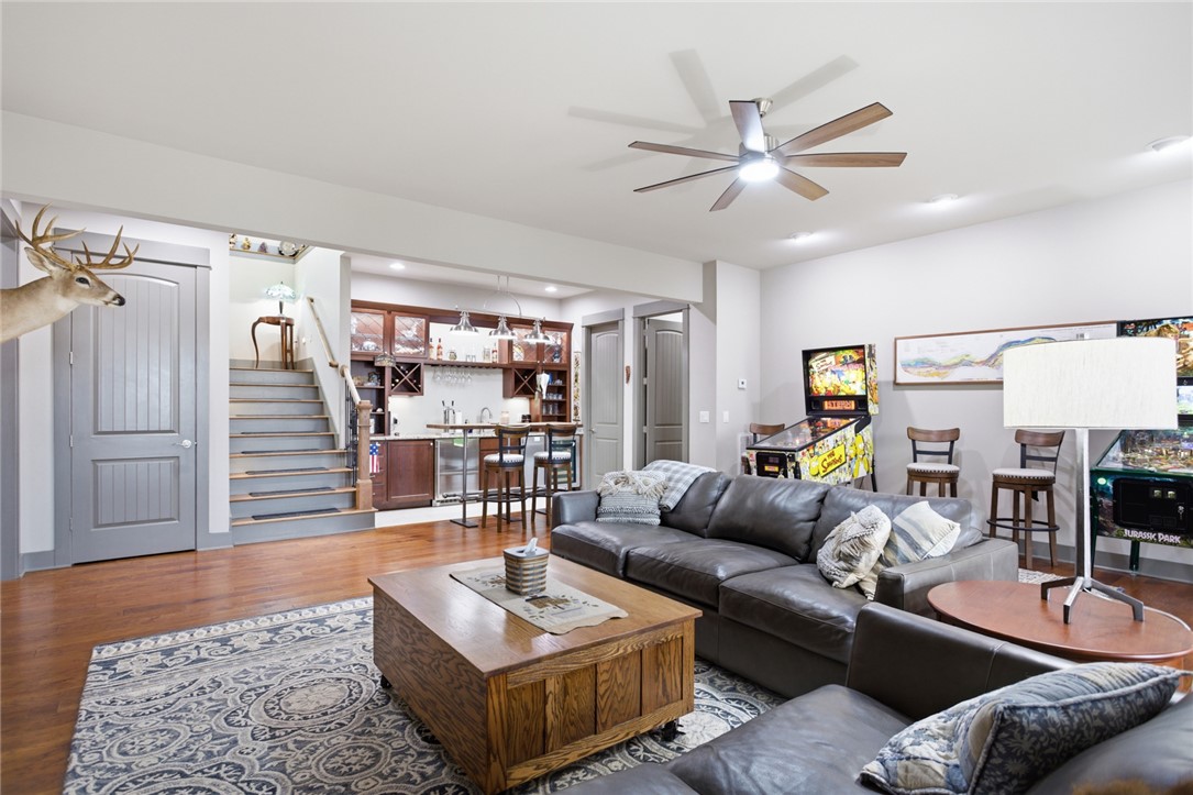 412 Walking Fern Way Seneca, SC 29672 - Photo 21 of 45 This spacious lower level living area features a built-in wet bar, and opens out to a 500+sqft concrete patio.