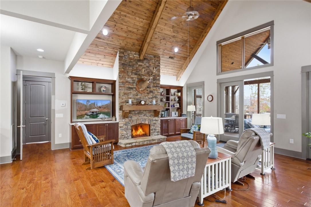 412 Walking Fern Way Seneca, SC 29672 - Photo 3 of 45 This inviting living area boasts a soaring vaulted wood ceiling and a captivating stone fireplace.
