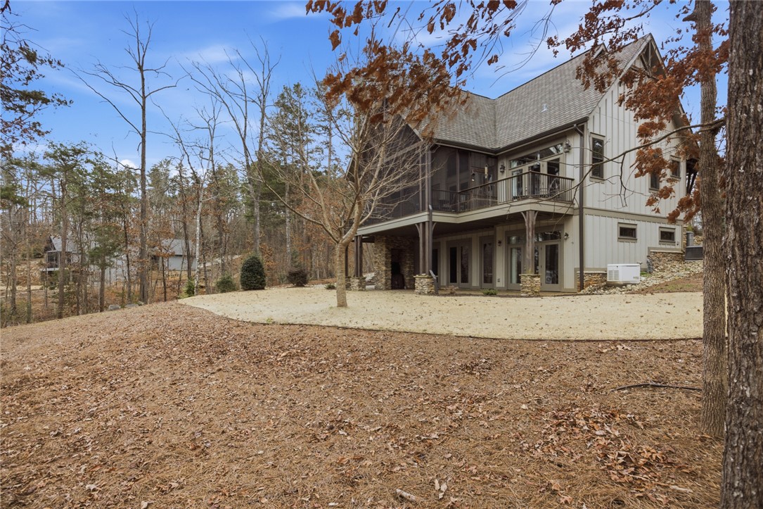 412 Walking Fern Way Seneca, SC 29672 - Photo 32 of 45 This elevated home offers scenic views and expansive outdoor living spaces, blending seamlessly with nature.