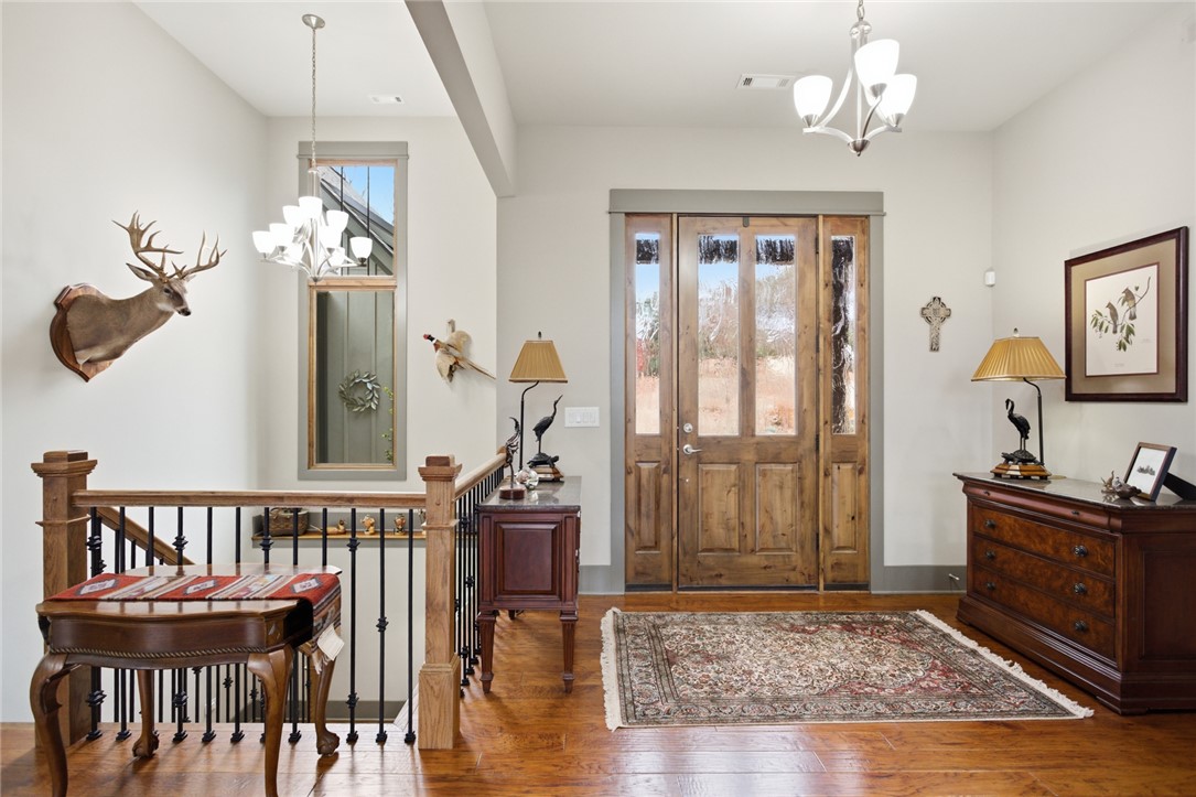 412 Walking Fern Way Seneca, SC 29672 - Photo 5 of 45 This entry features rich 8ft knotty alder door, high ceilings, and an open staircase.