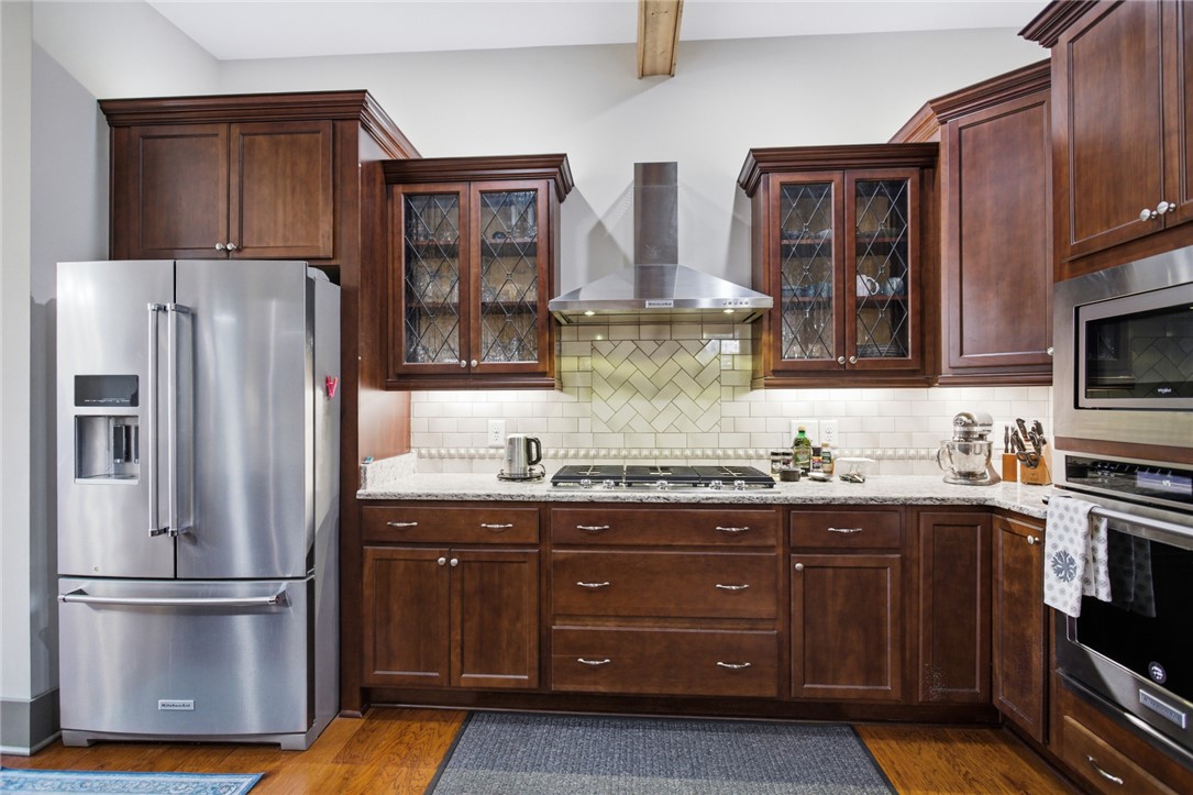 412 Walking Fern Way Seneca, SC 29672 - Photo 8 of 45 This spacious kitchen offers ample work space, bright lighting, and a gas cooktop.