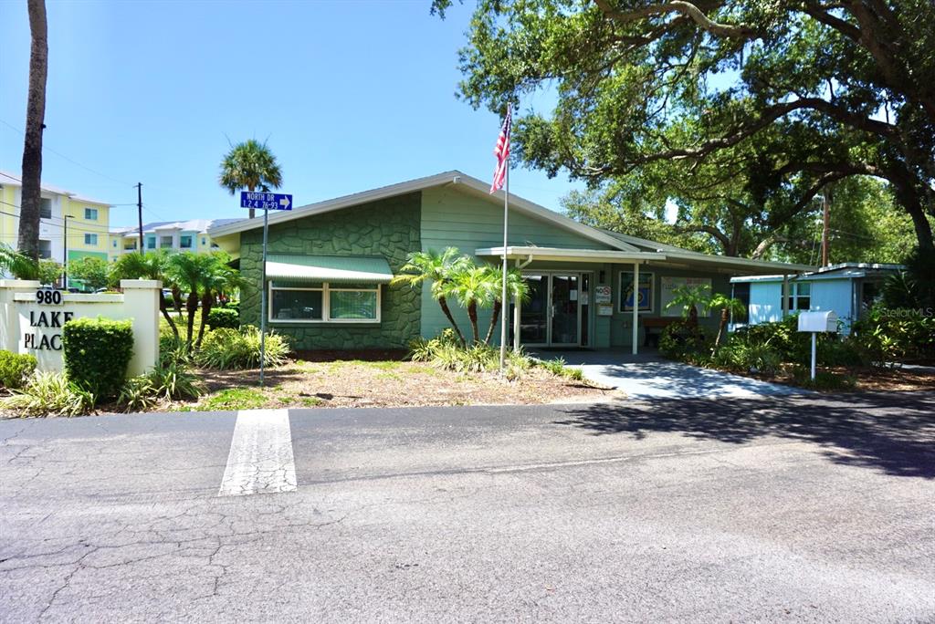 980 7th Street Northwest, Unit 71 Largo, FL 33770 - Photo 19 of 23 a front view of a house with yard