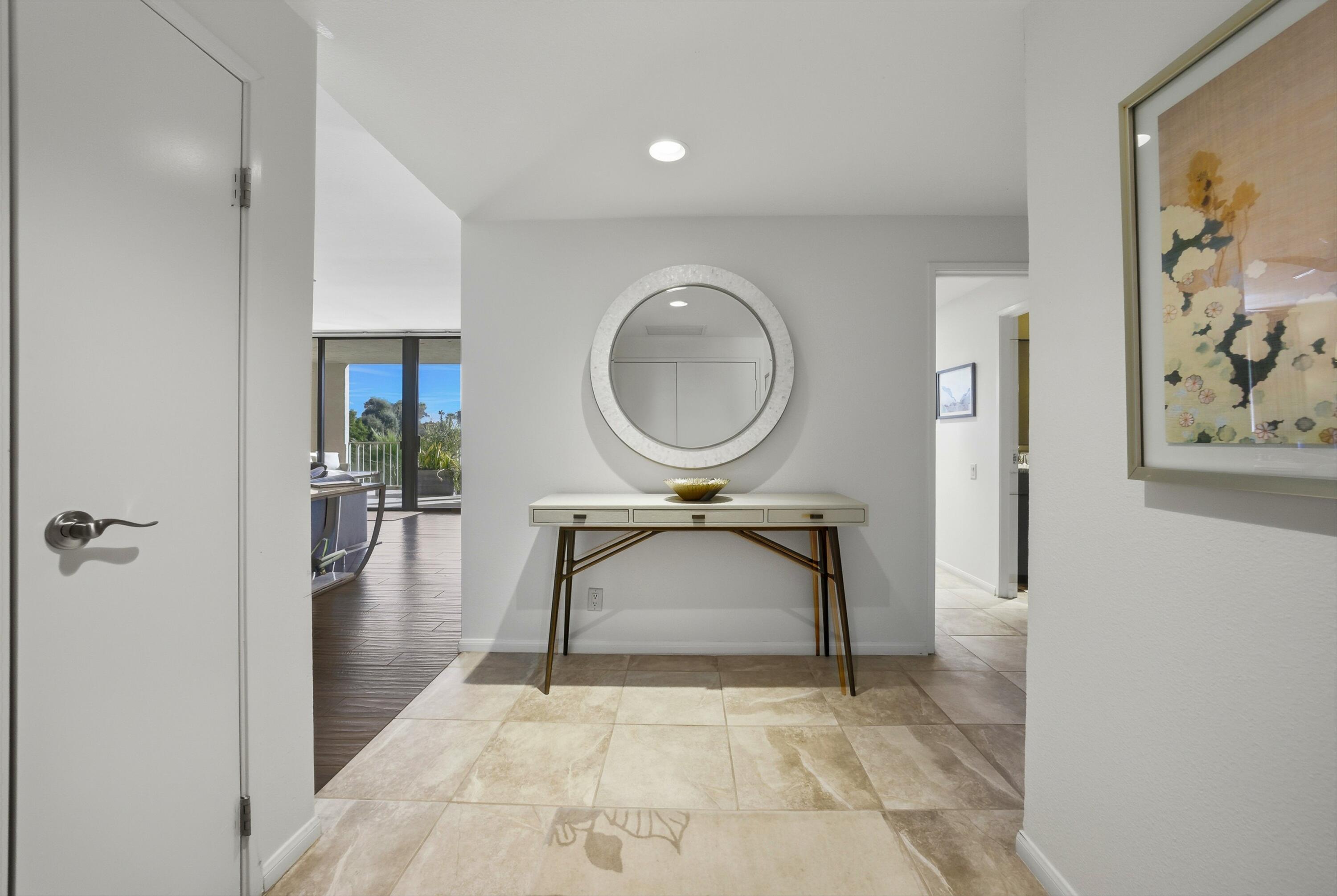910 Island Drive, Unit 207 Rancho Mirage, CA 92270 - Photo 2 of 27 a bathroom with a sink toilet and a mirror