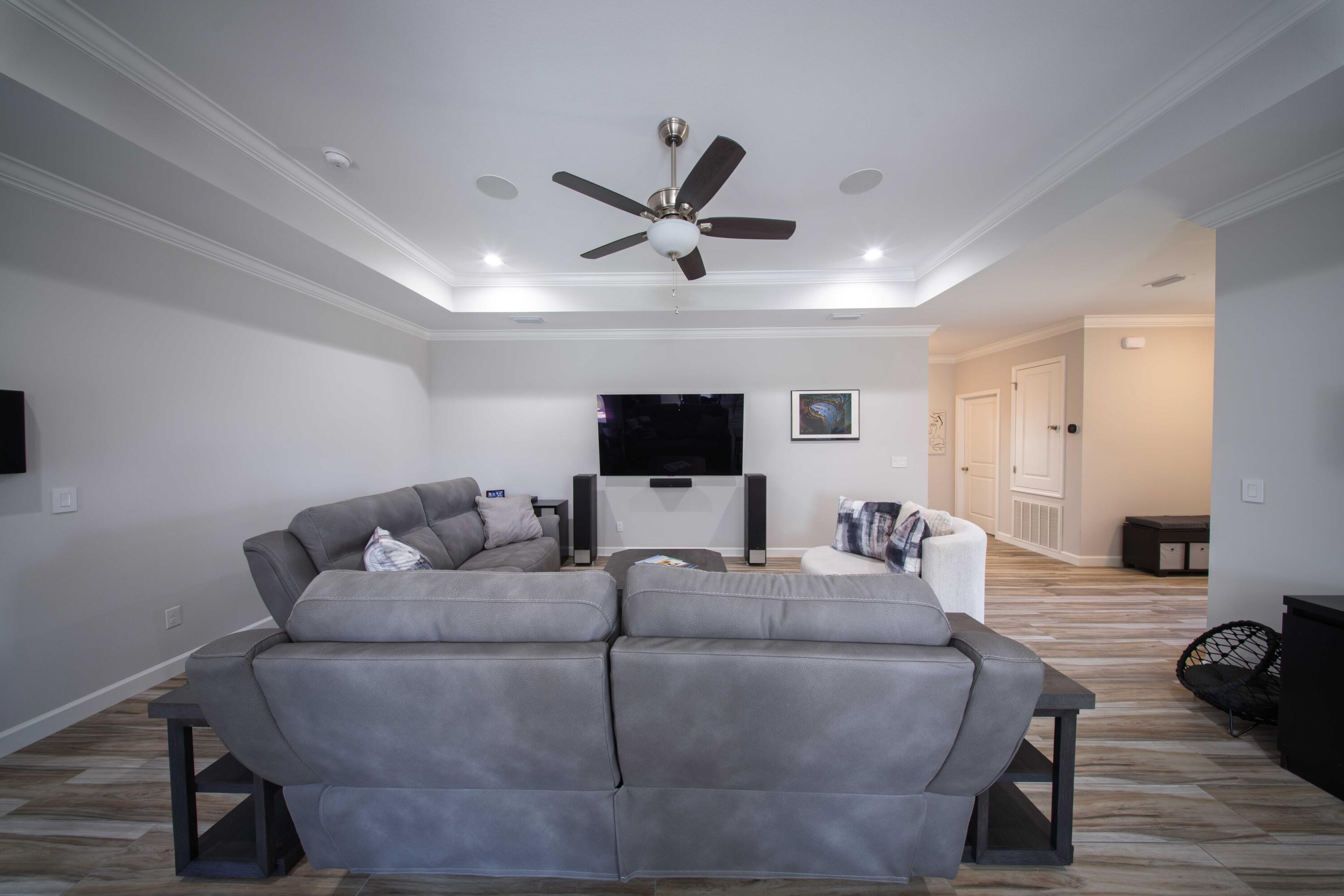 474 Sara Avenue Mary Esther, FL 32569 - Photo 13 of 46 a living room with furniture and a flat screen tv