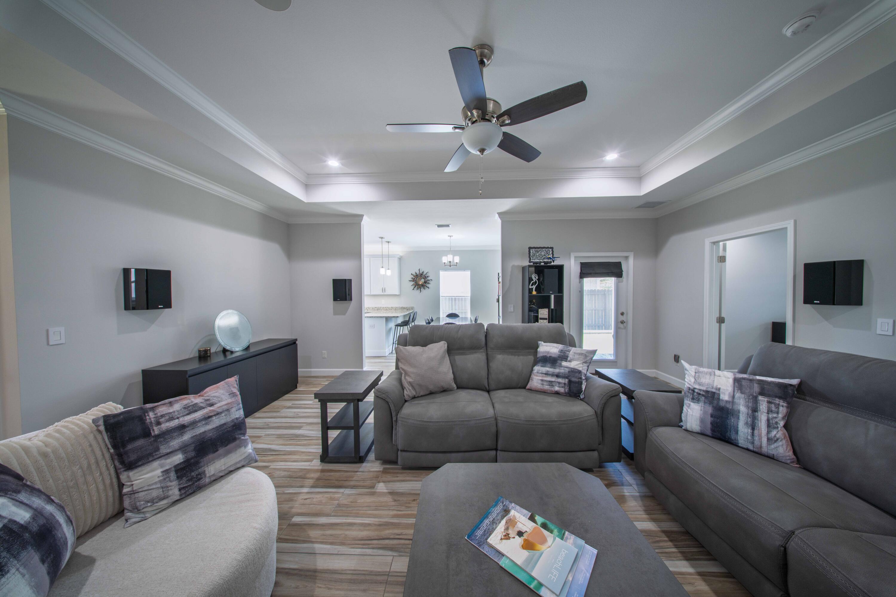 474 Sara Avenue Mary Esther, FL 32569 - Photo 14 of 46 a living room with furniture and a view of kitchen