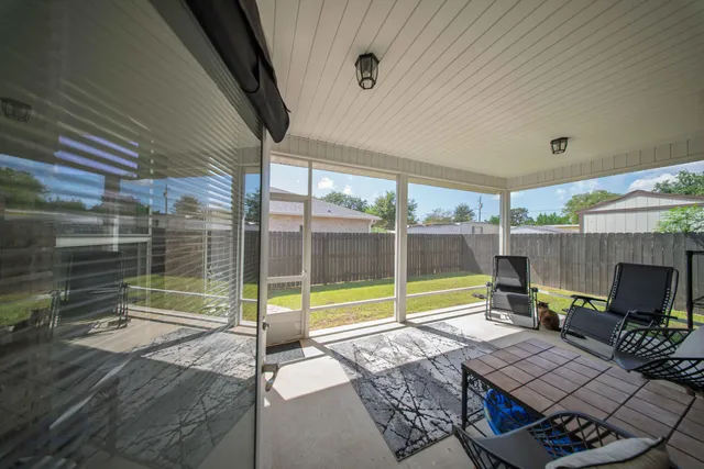a view of backyard with seating area and furniture