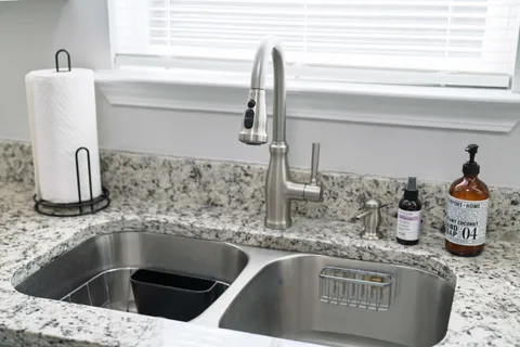 a kitchen with a sink and a window