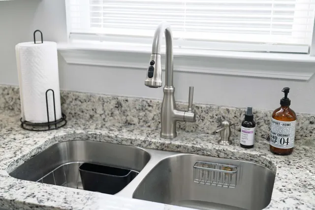 a kitchen with a sink and a window
