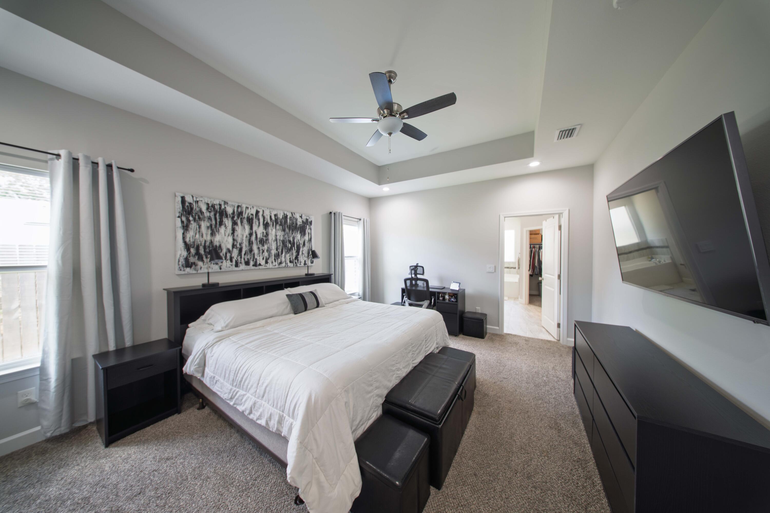 474 Sara Avenue Mary Esther, FL 32569 - Photo 24 of 46 a bedroom with a bed a mirror on desk and a window