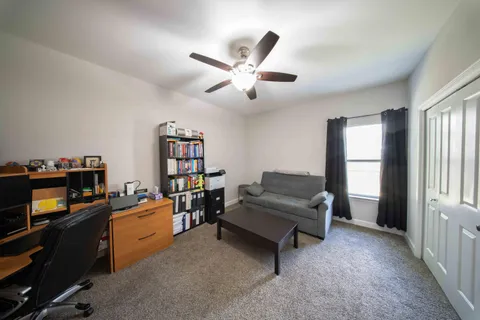 a view of a backyard with pathway