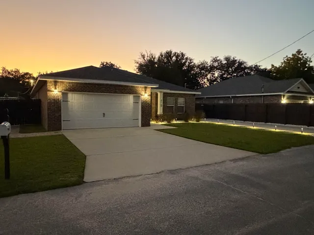 a view of backyard with trampoline
