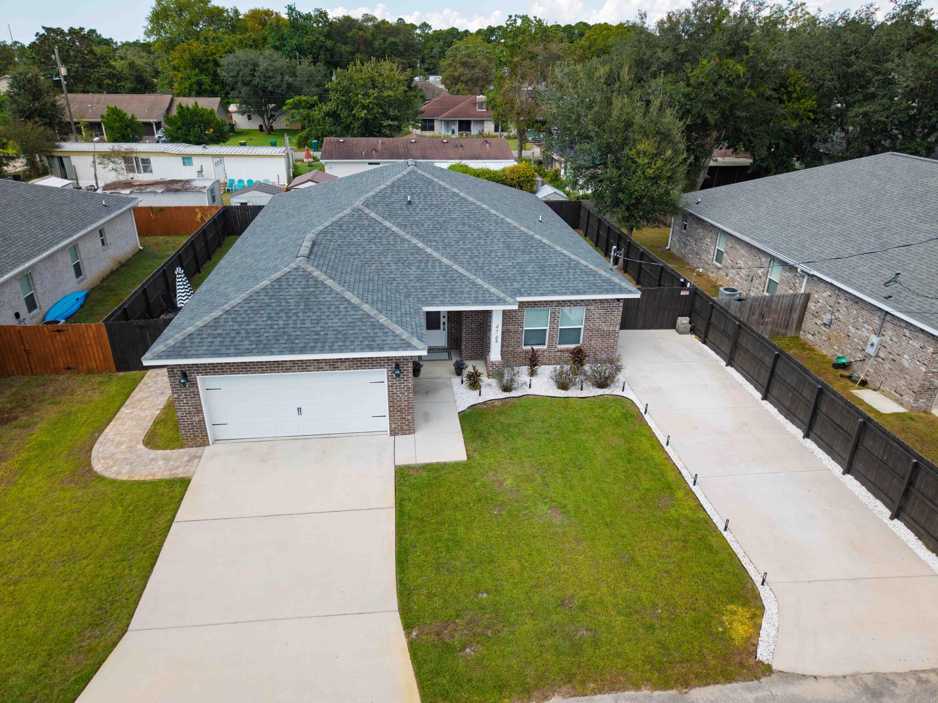 474 Sara Avenue Mary Esther, FL 32569 - Photo 41 of 46 an aerial view of a house with swimming pool and furniture