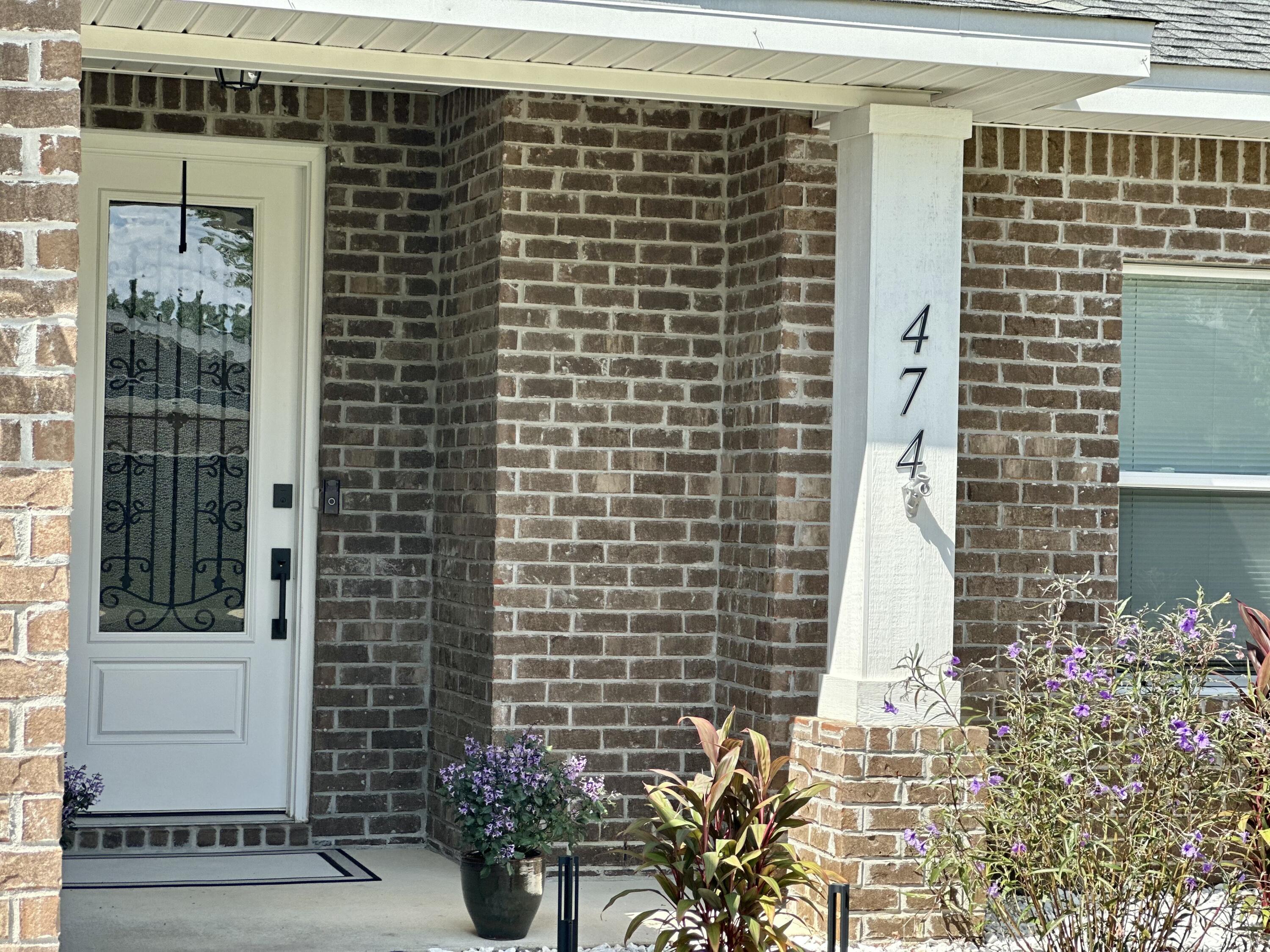 474 Sara Avenue Mary Esther, FL 32569 - Photo 8 of 46 a view of a brick house