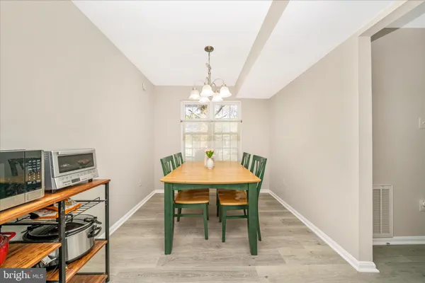 a kitchen with cabinets a sink and appliances