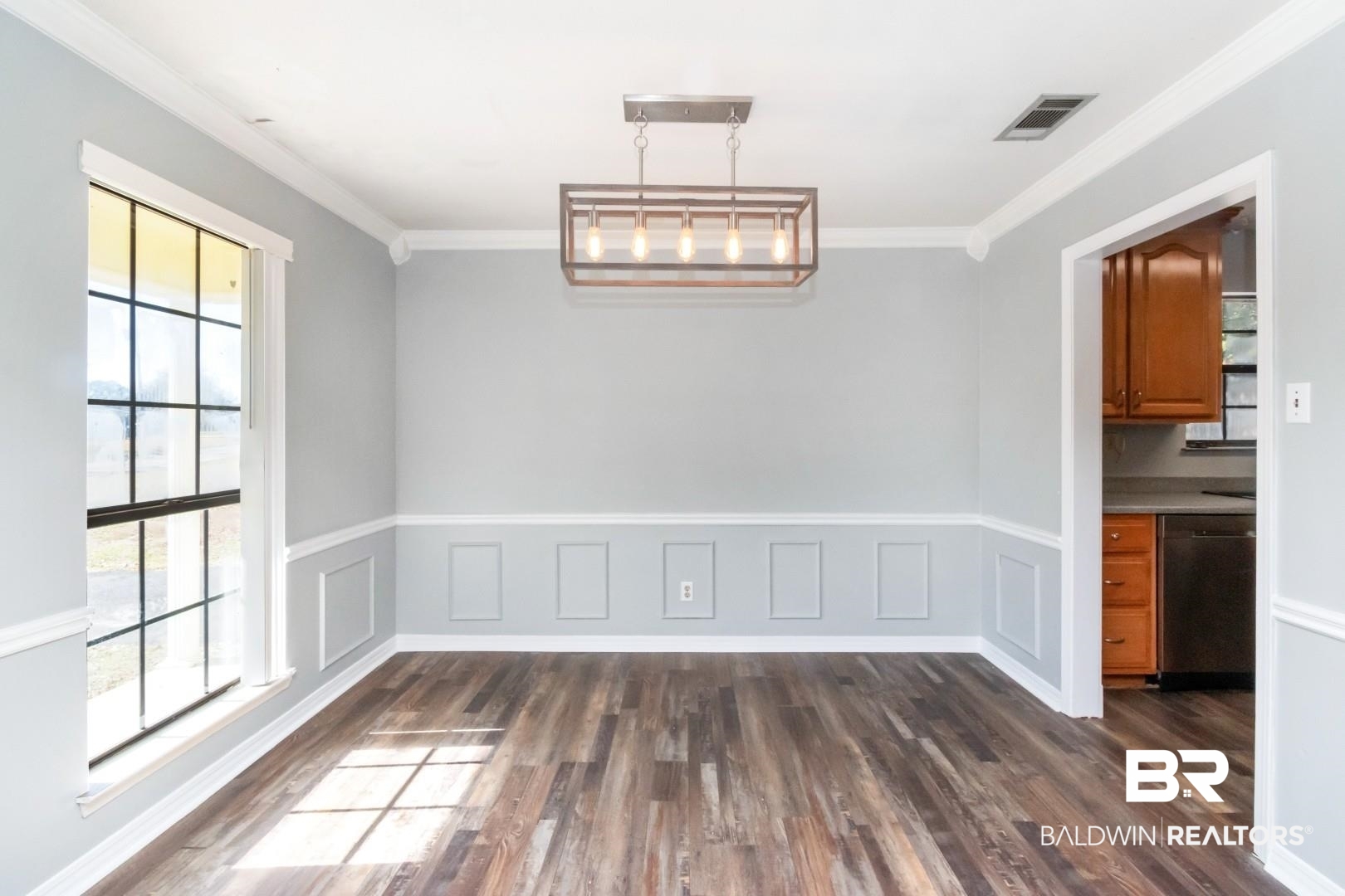 8304 Champlain Circle Mobile, AL 36695 - Photo 9 of 46 Unfurnished dining area with ornamental molding and dark hardwood / wood-style floors