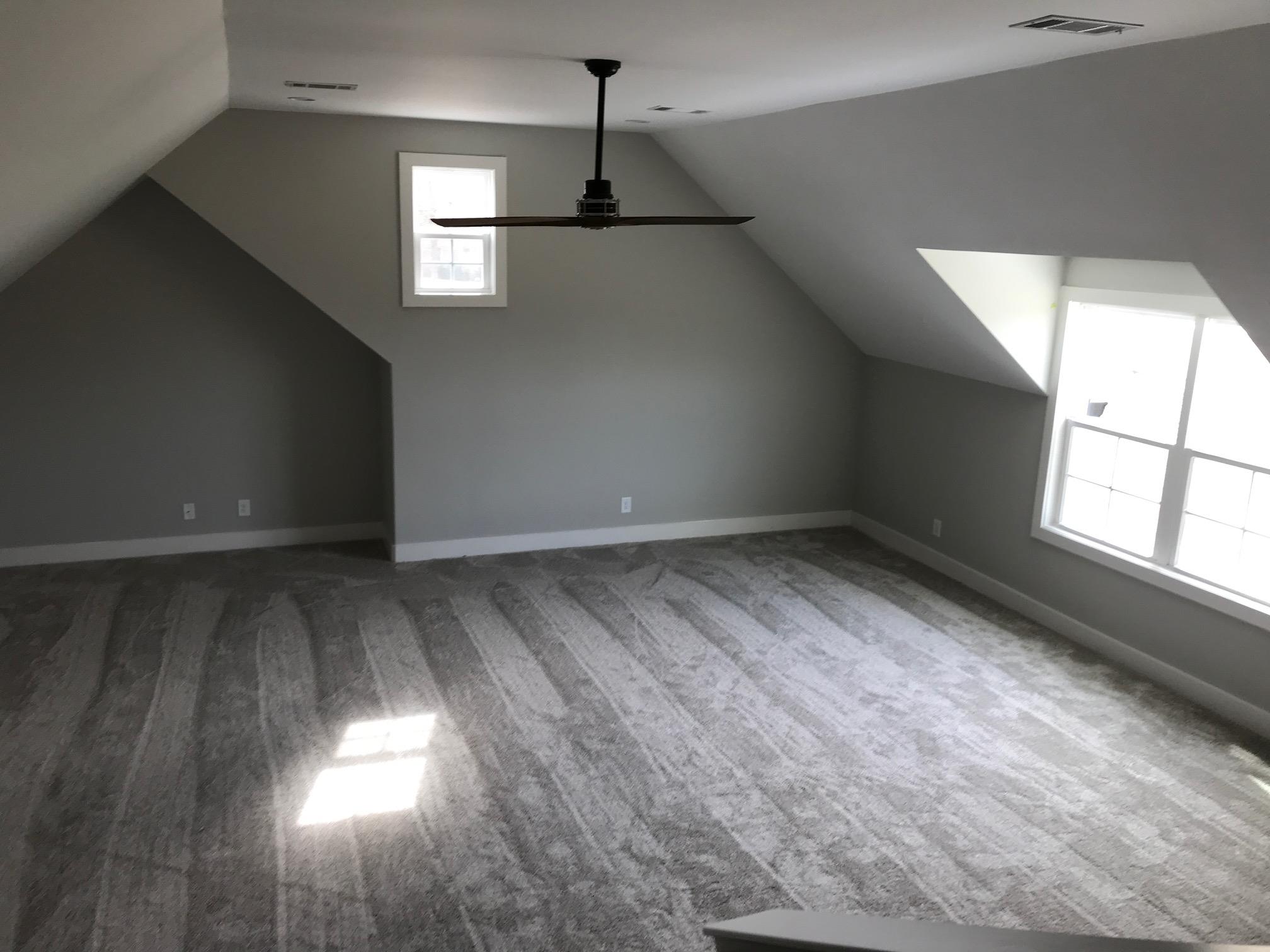 759 Philadelphia Road Lebanon, TN 37087 - Photo 21 of 21 an empty room with wooden floor and windows
