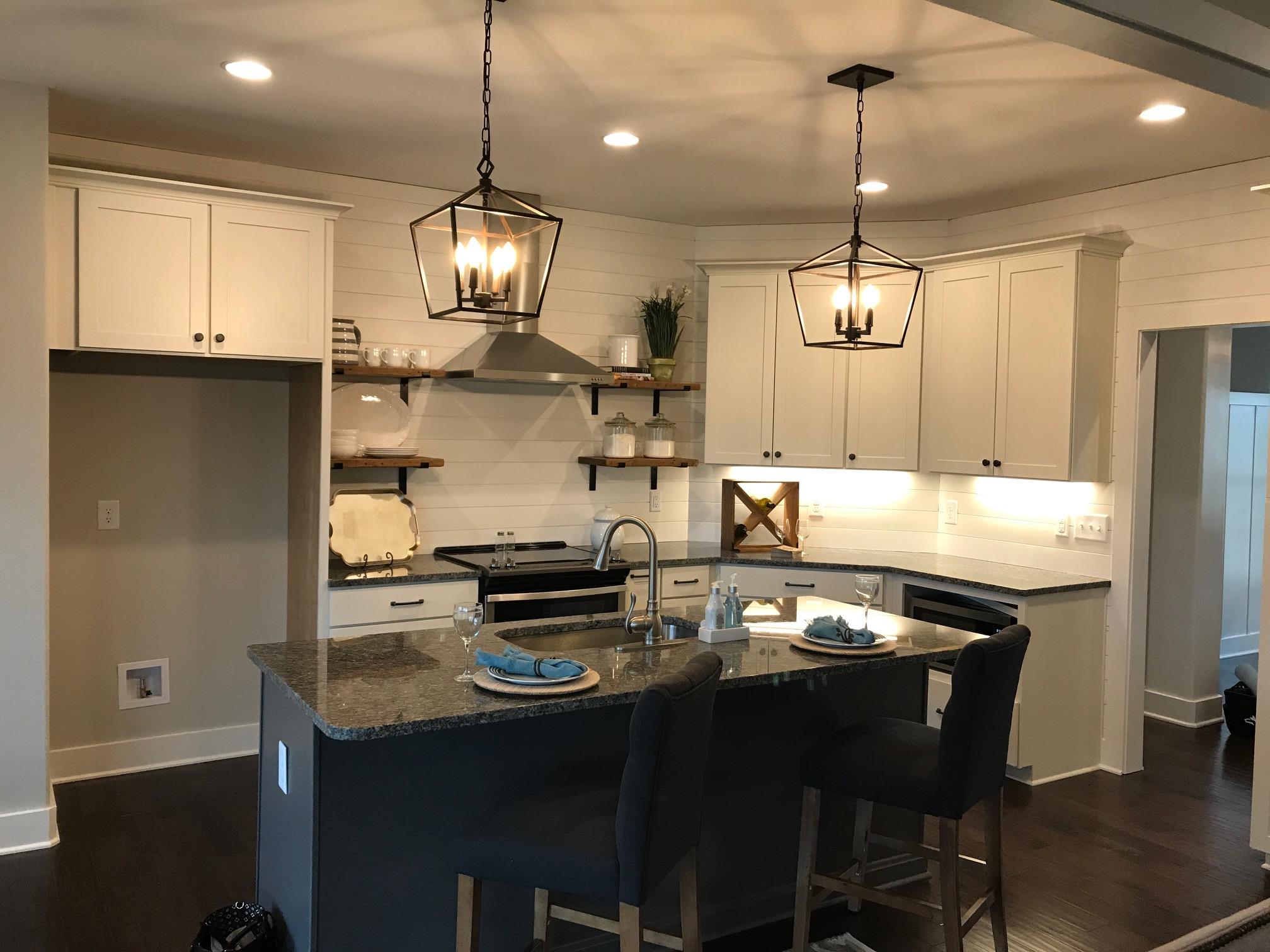 759 Philadelphia Road Lebanon, TN 37087 - Photo 10 of 21 a kitchen with stainless steel appliances granite countertop a stove a refrigerator a sink and a table
