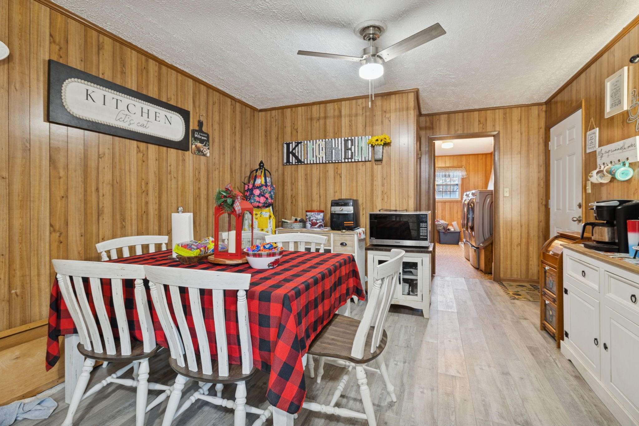 535 Gamaliel Road Red Boiling Springs, TN 37150 - Photo 12 of 30 a view of a dining room with furniture a chandelier and wooden floor
