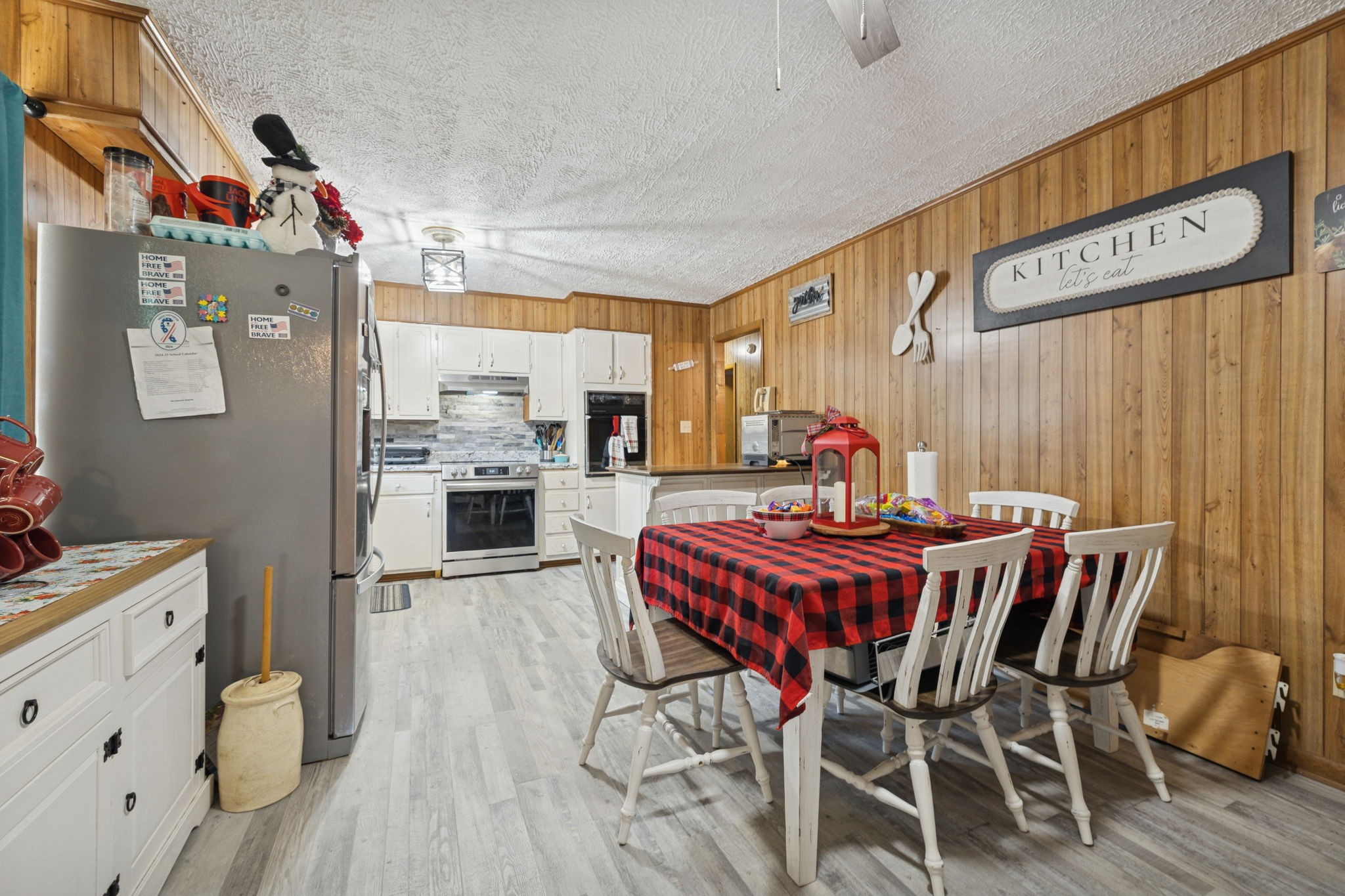 535 Gamaliel Road Red Boiling Springs, TN 37150 - Photo 13 of 30 a view of a dining room with furniture window and wooden floor
