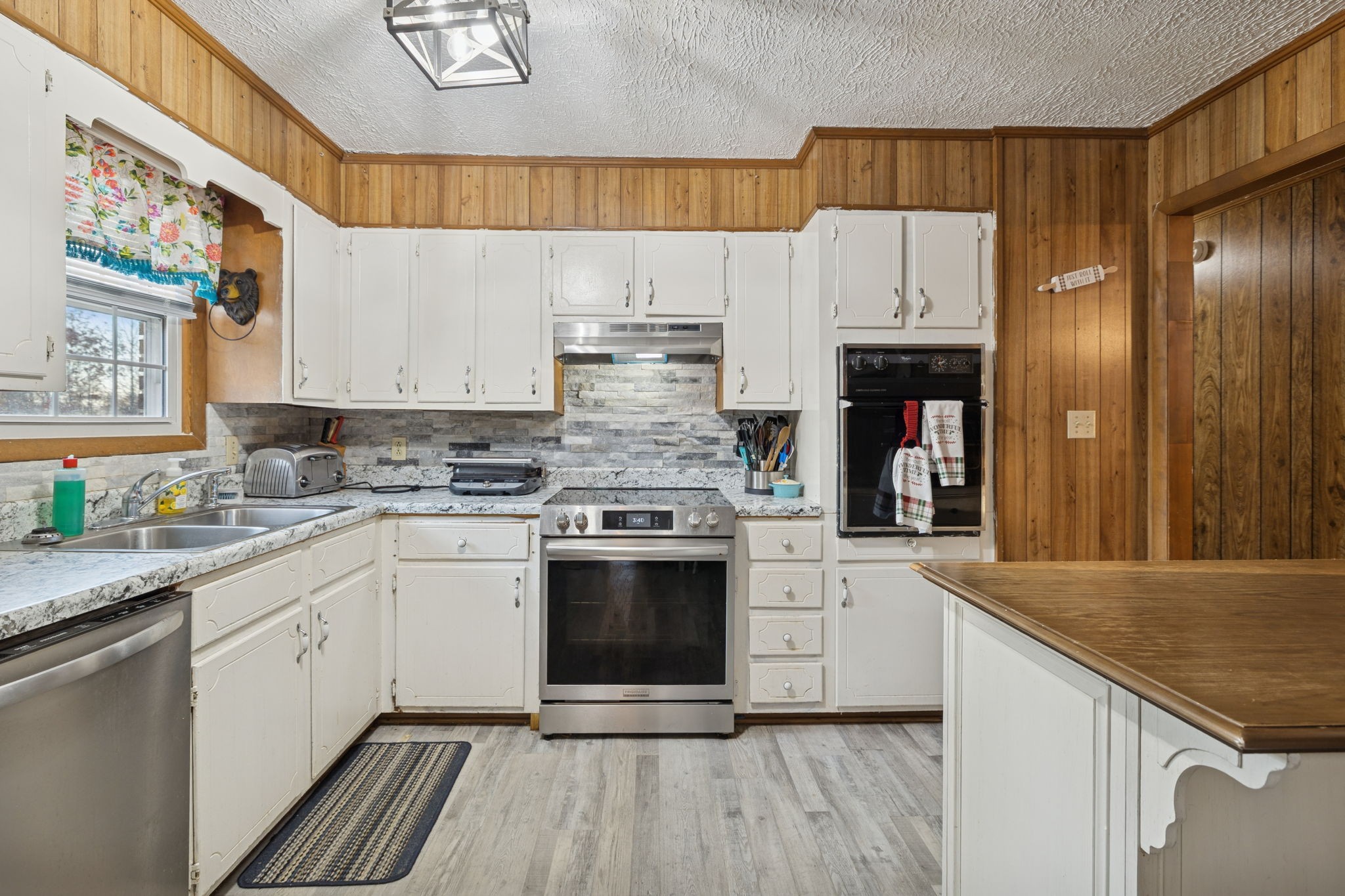 535 Gamaliel Road Red Boiling Springs, TN 37150 - Photo 14 of 30 a kitchen with stainless steel appliances granite countertop a stove a sink and a refrigerator