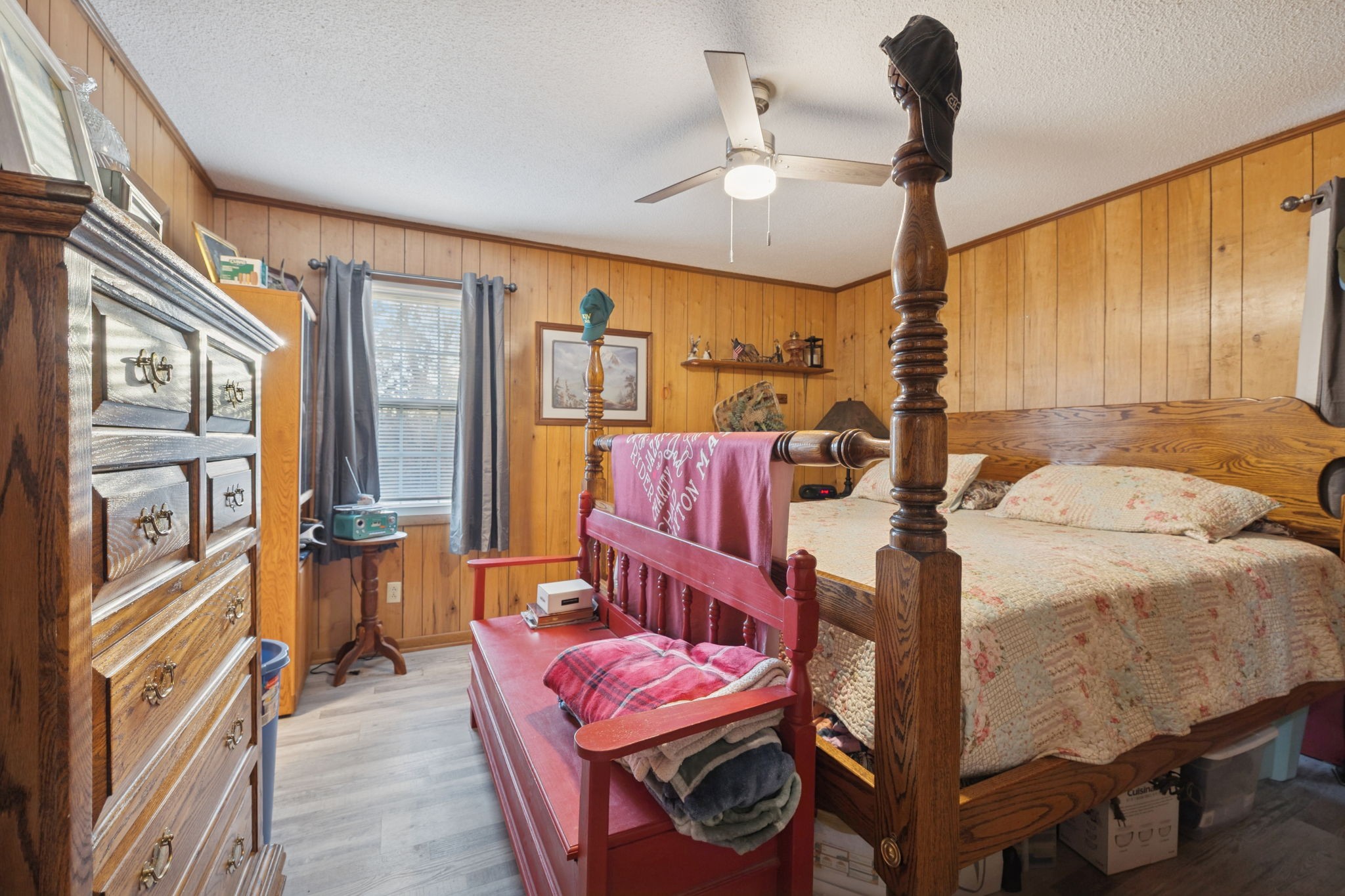 535 Gamaliel Road Red Boiling Springs, TN 37150 - Photo 20 of 30 a bedroom with furniture and a chandelier