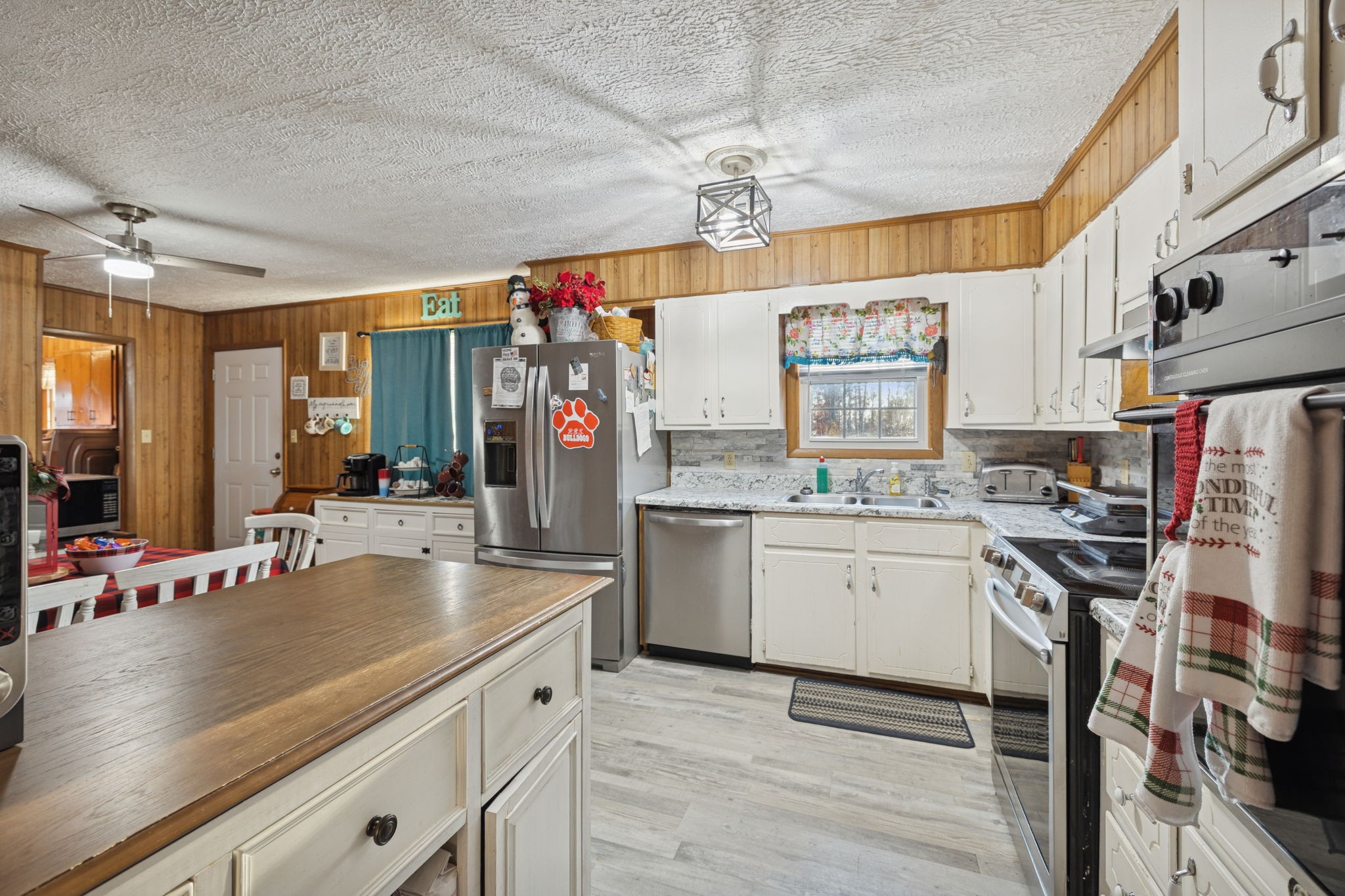 535 Gamaliel Road Red Boiling Springs, TN 37150 - Photo 9 of 30 a kitchen with stainless steel appliances granite countertop a sink stove and refrigerator