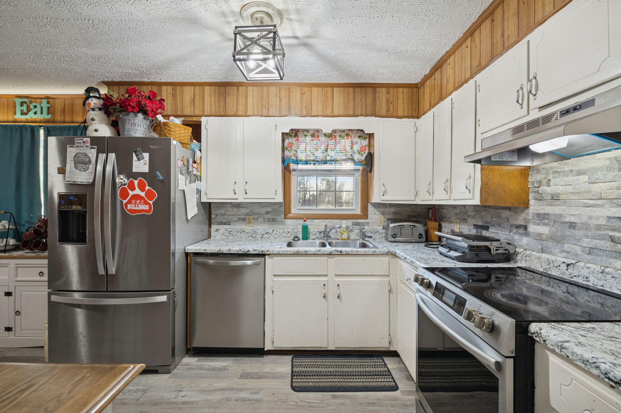 535 Gamaliel Road Red Boiling Springs, TN 37150 - Photo 10 of 30 a kitchen with stainless steel appliances granite countertop a sink stove and refrigerator
