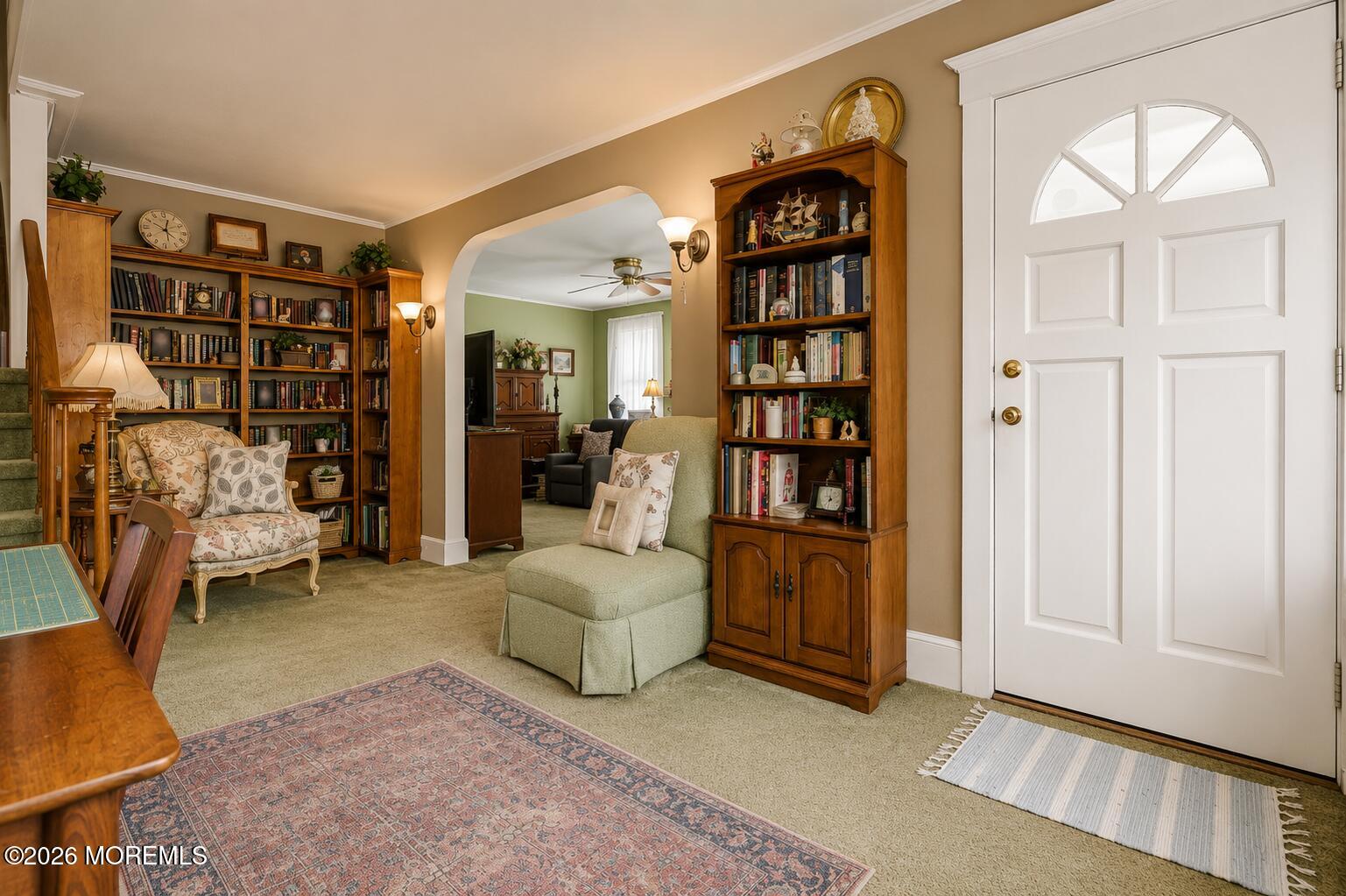 24 Foster Street Middletown, NJ 07701 - Photo 4 of 23 a living room filled with furniture and a book shelf