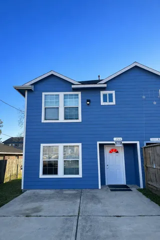 a front view of building with yard