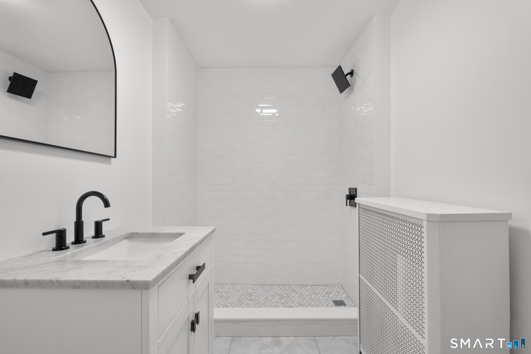 74 Cold Spring Street New Haven, CT 06511 - Photo 16 of 40 a bathroom with a sink and mirror