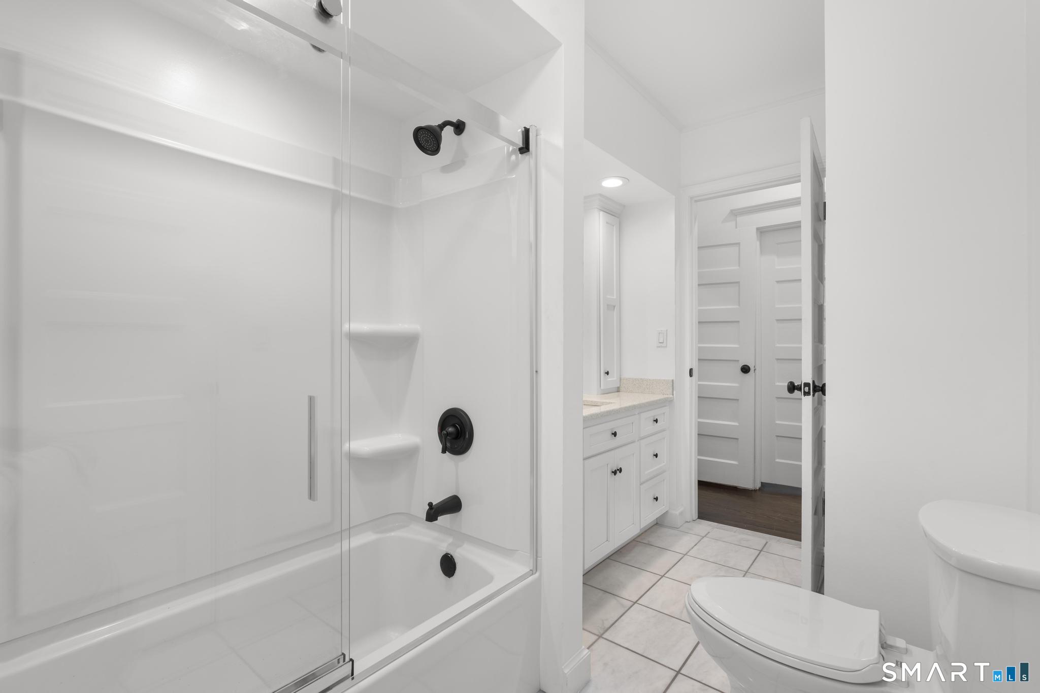 74 Cold Spring Street New Haven, CT 06511 - Photo 23 of 40 a bathroom with a bathtub toilet and shower