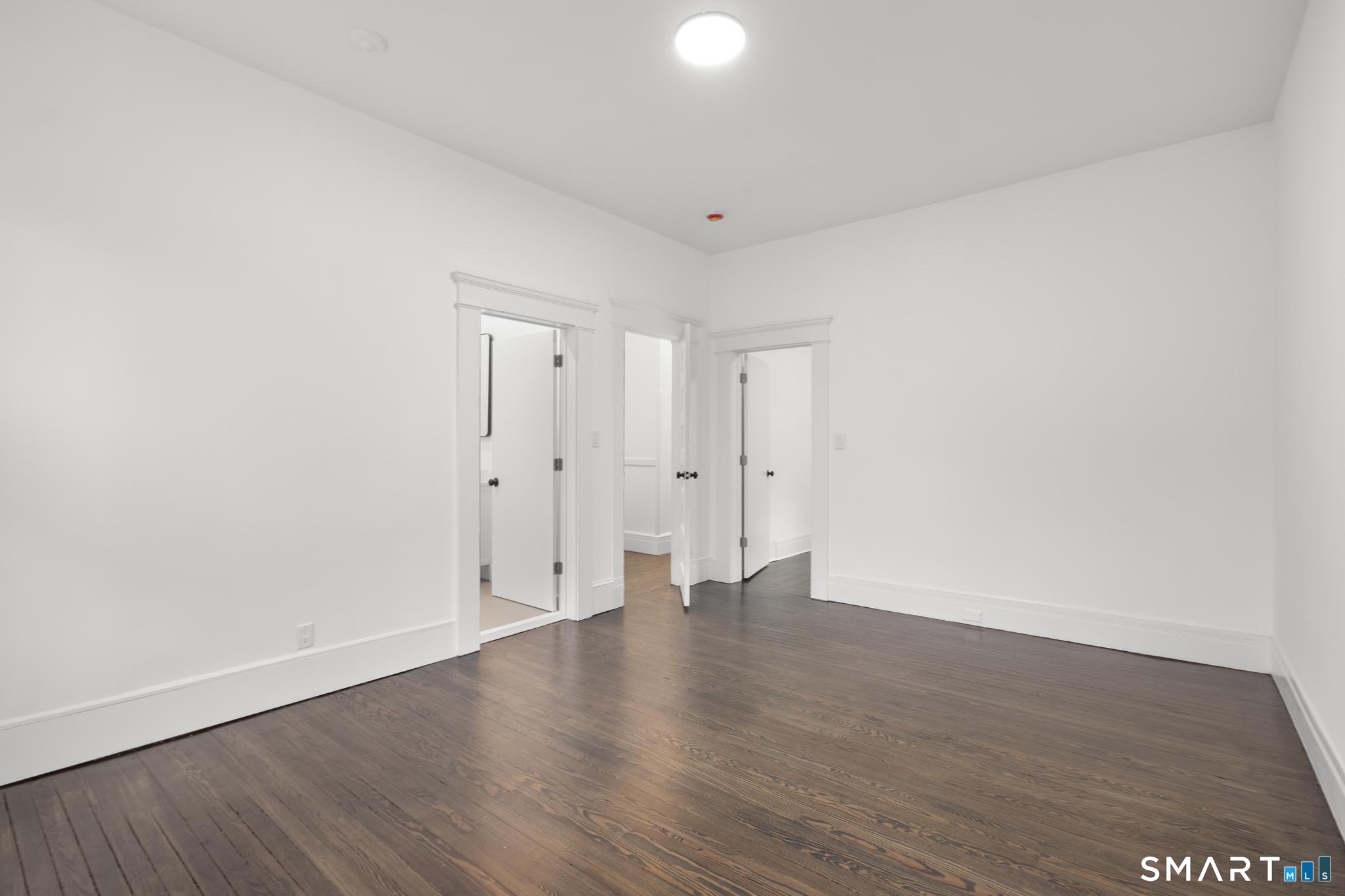 74 Cold Spring Street New Haven, CT 06511 - Photo 24 of 40 a view of an empty room with wooden floor